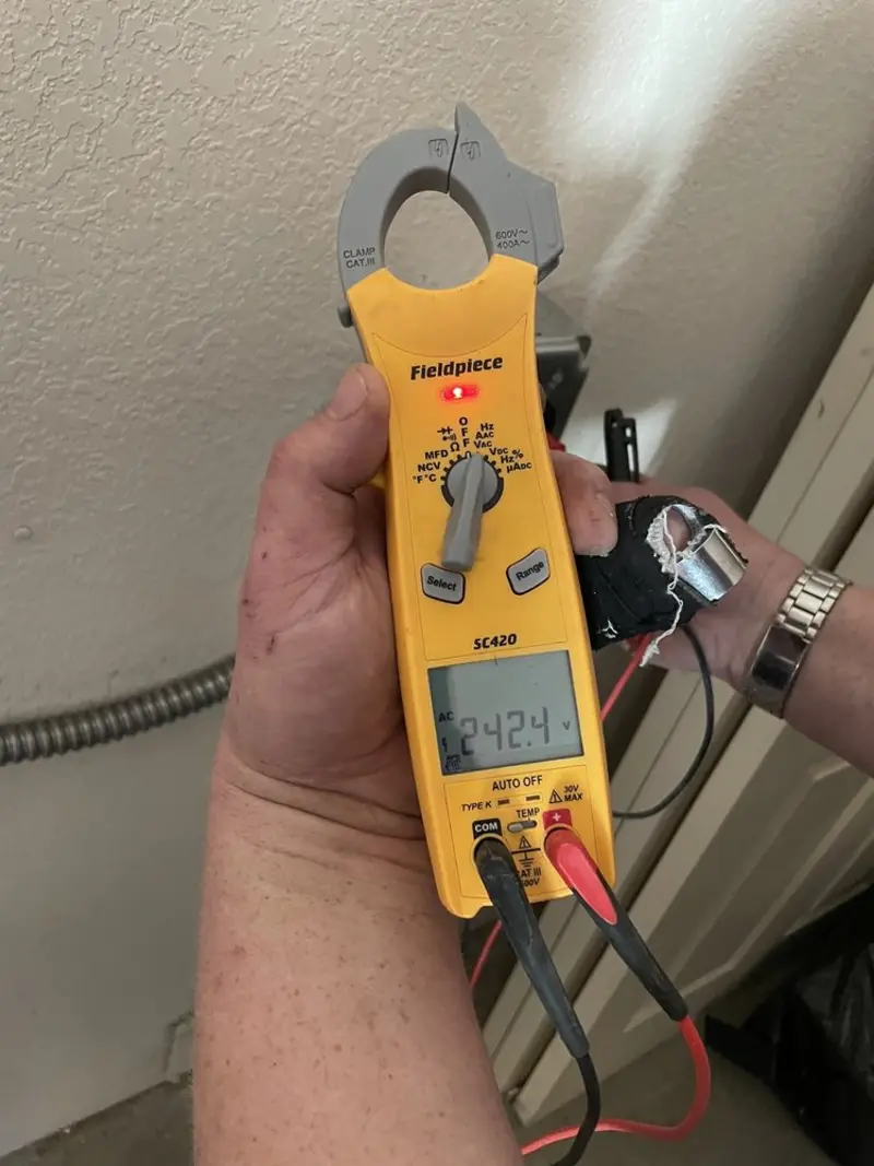 Voltage testing with clamp meter during Ceiling Fan Installation in Sparta